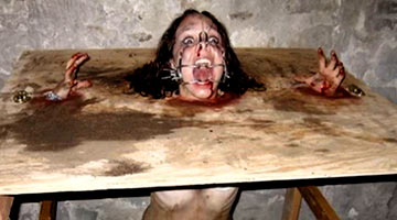 Brutal facial torment in a dark dungeon. The girl is terrified by the Master sadist